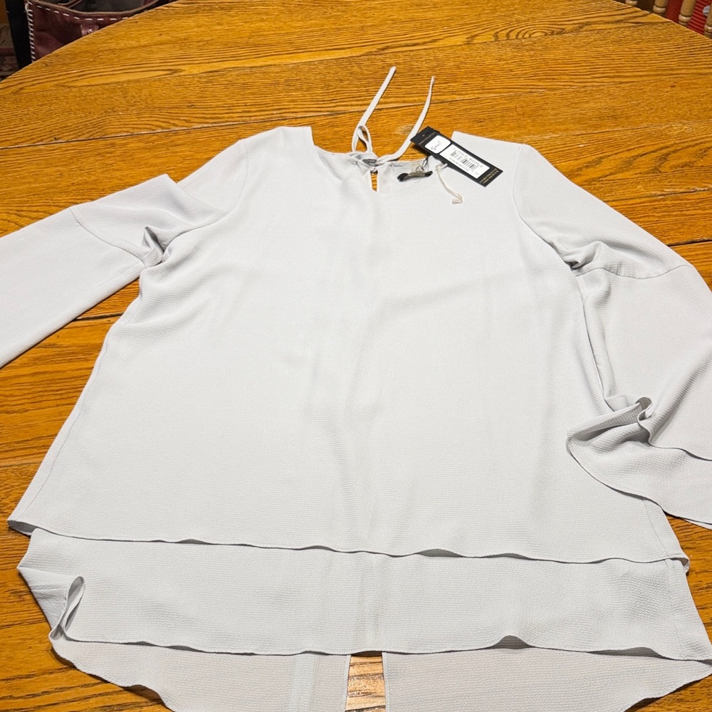 Renaur light gray layered tunic top.  Crepe polyester with bell sleeves. Small.